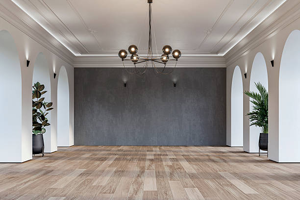 istock Modern empty interior with elegant arched openings, decorative ceiling molding, chandelier and decorative potted plants 2225804810