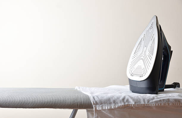 istock Home ironing concept with iron, board and shirt, isolated background 2225806290