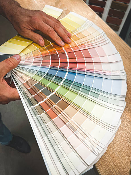 istock man chooses paint for renovation 2225809562