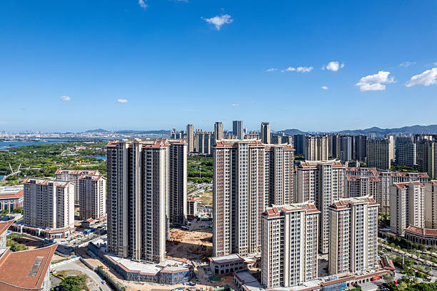 istock An aerial view shows a modern city under a blue sky. 2225810040