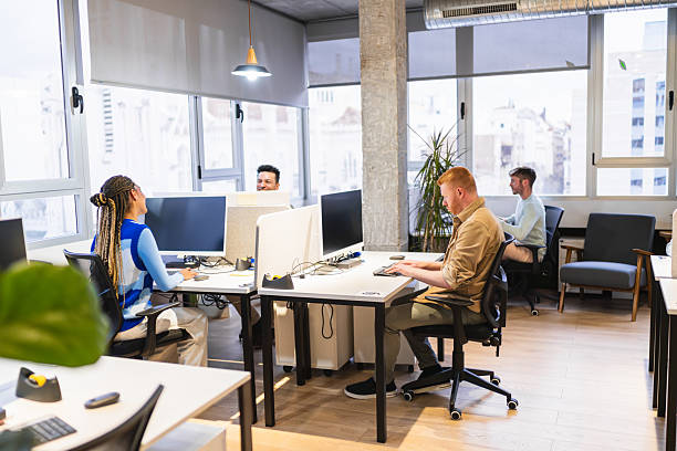 istock Young professionals collaborating in modern coworking space 2225810780