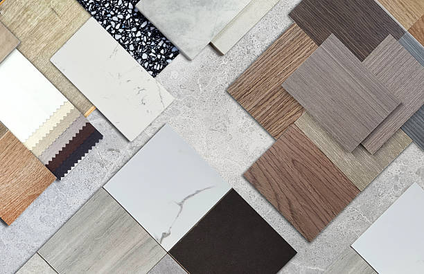 istock Diverse interior design material samples: wood veneer, laminate, marble, stone tile, terrazzo, fabric, artificial stone swatches placed on grey marble stone background. 2225811669
