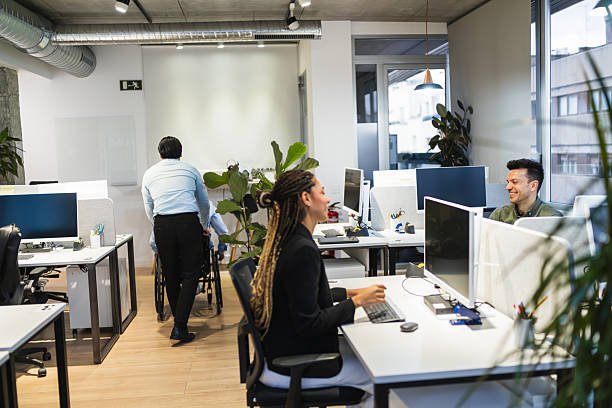 istock Young professionals working in a modern coworking space 2225812791