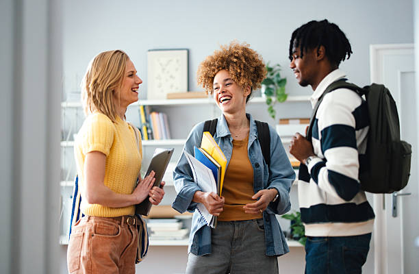 istock Group of Students Laughing Together in a Library Setting 2225814039