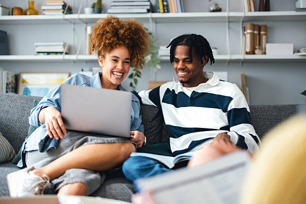 istock Two Friends Studying Together on Couch in a Cozy Living Space 2225814058