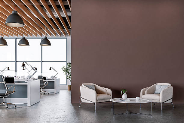 istock Modern Office Interior with chocolate brown wall and Minimalist Lounge Area on microcement floor 2225815524