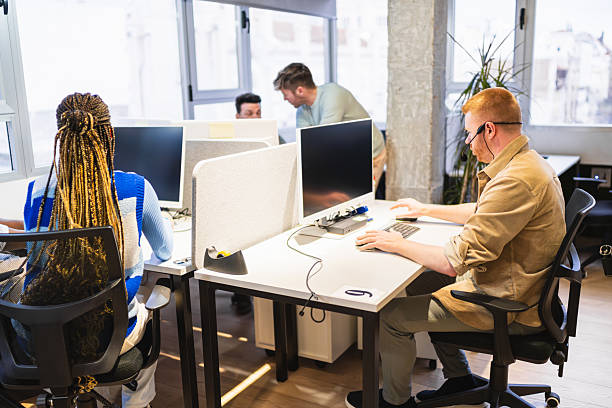istock Young professionals collaborating in modern coworking space 2225816826