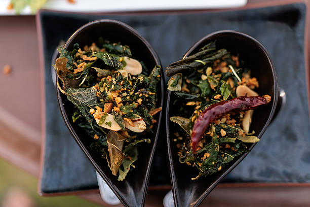 Fresh and healthy Thai salad presented in two bowls arranged side by side to subtly form a heart shape.