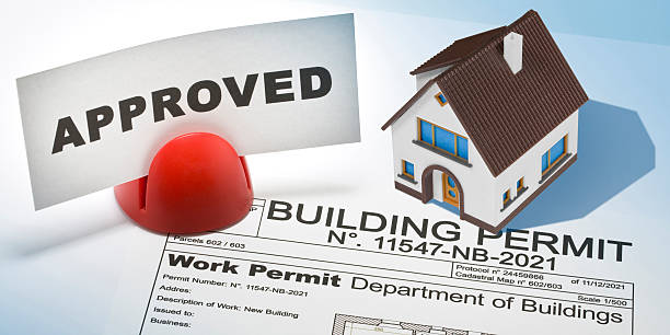 istock APPROVED BUILDINGS PERMIT CONCEPT with approved residential building project and home residential building model 2225820110