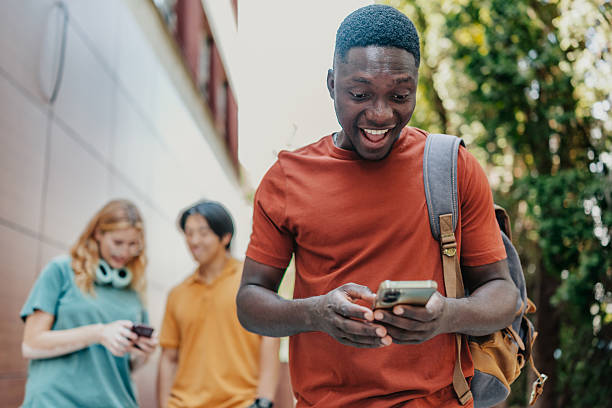 istock Young adults celebrate financial success with excitement and joy while using mobile technology outdoors 2225820524