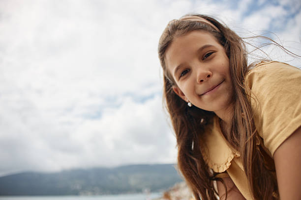 Beautiful girl enjoying springtime on the seaside.