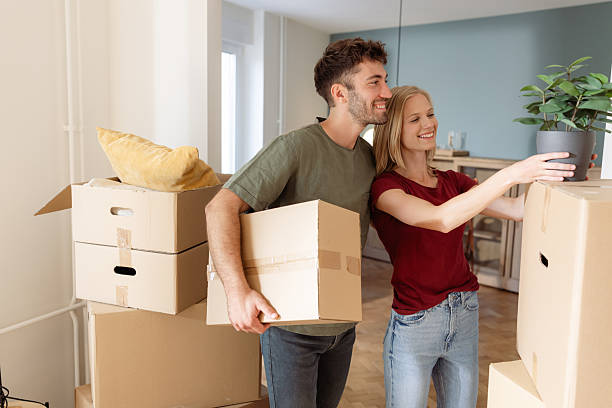 istock Happy couple moving into their new home together 2225823670