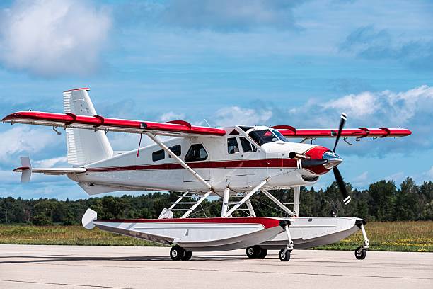 istock Side view of red and white floatplane with spinning propeller 2225829949