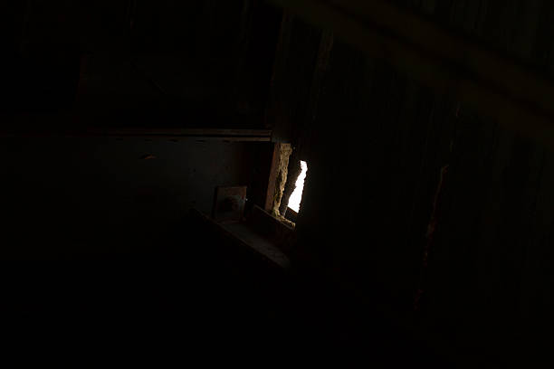 istock There is a window located in a dark room, and light is shining out 2225830363