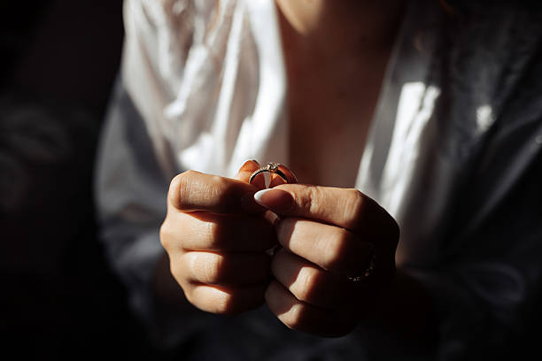 istock A woman is holding a ring in her hand 2225831272
