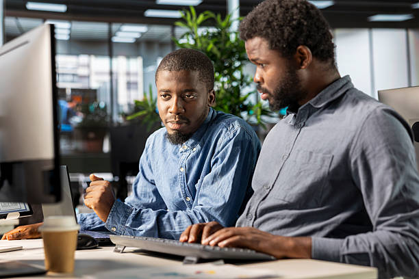 istock General manager working closely with a team member on planning business tasks 2225832342