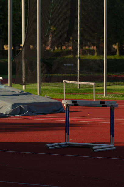 istock A hurdle situated on a track with a fenced area visible behind it 2225832770