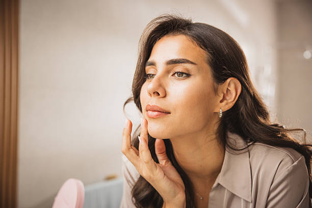 istock Young woman having morning routine in bathroom 2225834640