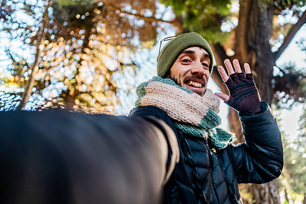 istock Mid adult man taking a selfie outdoors - Camera point of view 2225835286