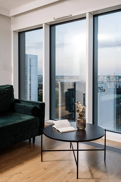 istock Modern living room with white PVC window frame and stunning city view 2225835542