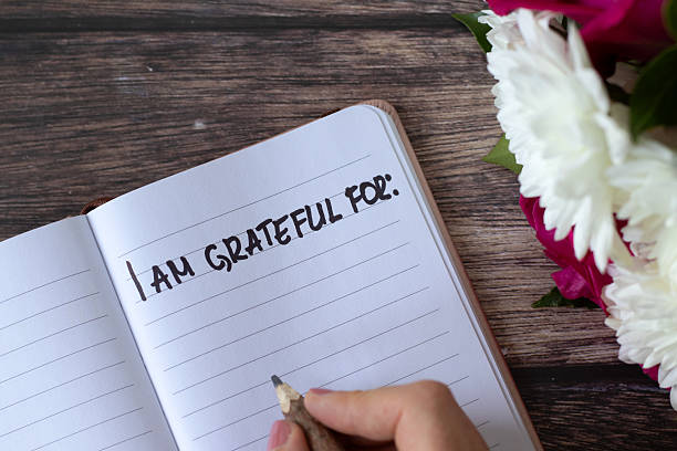 istock I am grateful handwritten text in notebook on wooden table with flowers 2225835832