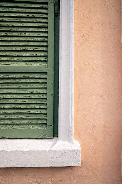 istock Close-up of Green Shutter on Pink Bermuda Wall 2225837589