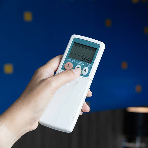 istock Smart air conditioner remote hand control temperature cooling heating air conditioning technology adjustable heat settings efficiency automation home comfort monitoring operation. 2225837797