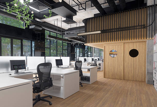 istock Modern office space with empty desks and computers. Contemporary workspace for business and productivity. 2225841002