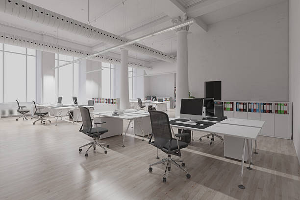 istock Empty modern office space with multiple white desks and chairs. Clean contemporary business interior for corporate work. 2225841004