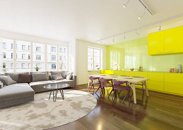 istock Spacious apartment living room and kitchen interior with modern design. Open concept home decor with bright yellow kitchen cabinets. 2225841015