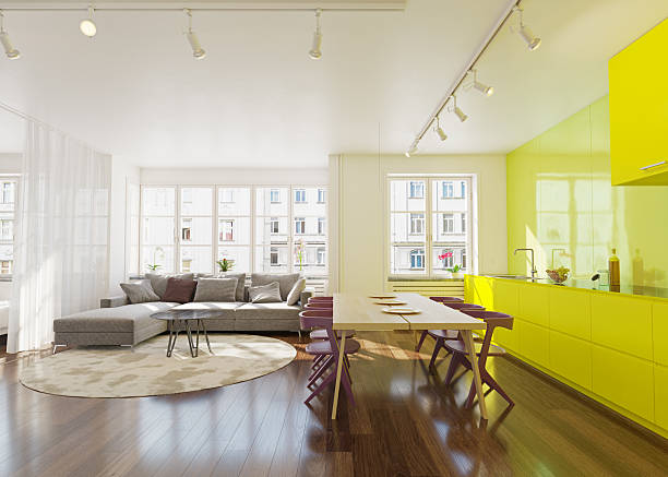 istock Modern apartment interior with bright yellow kitchen cabinets and a spacious living room. Contemporary home design concept for real estate. 2225841027