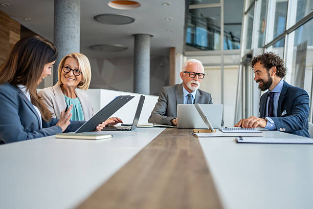 istock Business team collaborating on project in modern office 2225841201