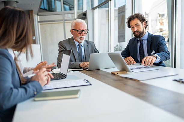 istock Business people working together on project in modern office 2225841218