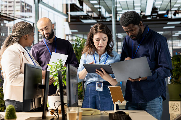 istock Ambitious work team collaborates on a financial planning project in an office 2225842213