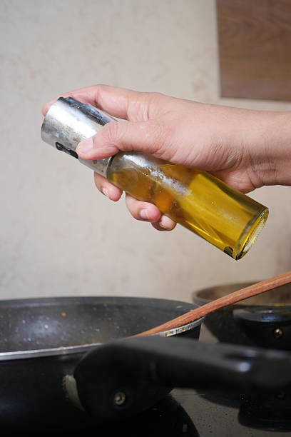 istock Cooking with olive oil in a kitchen setting during meal preparation 2225842491