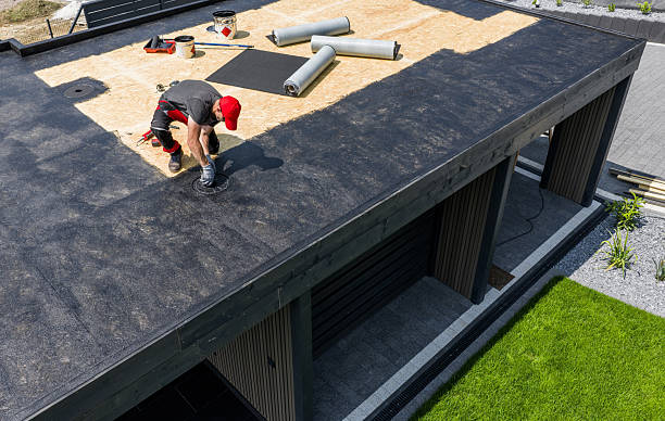istock Construction Worker Applying EPDM Roofing Material on Modern House During Daytime 2225846048