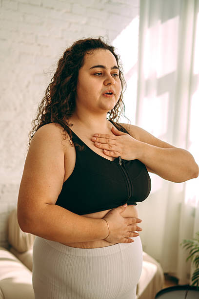 istock A young curly-haired plus-size woman doing breathing exercises.Healthy lifestyle 2225847452