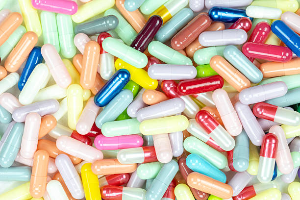 istock A vibrant, multi-colored background of assorted pharmaceutical capsules. This medicine texture is ideal for concepts of healthcare, drug production, and the pharmacy industry. 2225850097