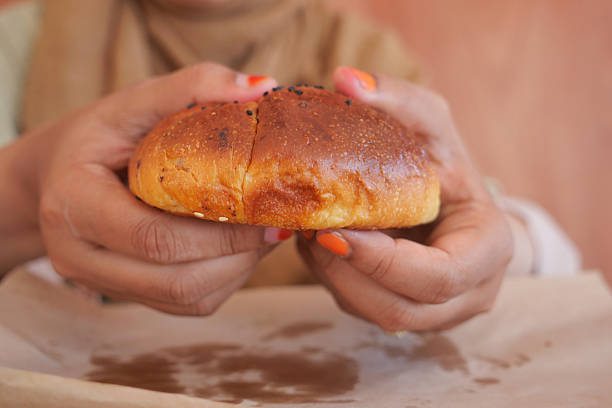 istock Enjoying freshly baked bread in a cozy bakery setting 2225855099