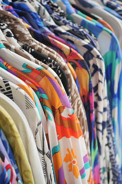 istock Vibrant and colorful clothing hanging on display in a boutique shop 2225856411