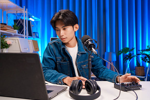 istock Young Asian Man Running Podcast Setup 2225857696