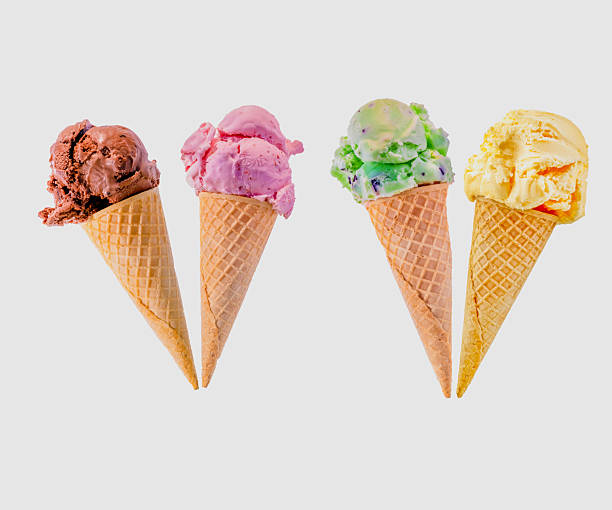 istock Four ice cream cones are displayed, each with a different flavor. The first is chocolate, Next is Strawberry then Mint Chocolate Chip and Creamy Vanilla isolated on a white background with copy space. 2225858049