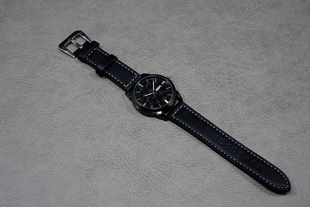 istock Black leather watch isolated on grey background close-up view 2225859140