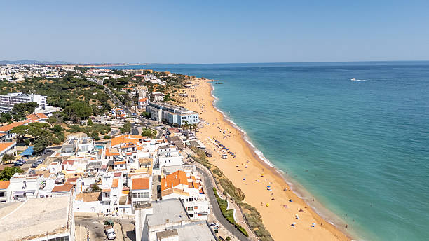 istock Colorful Beach Umbrellas on Algarve Coast 2225860861