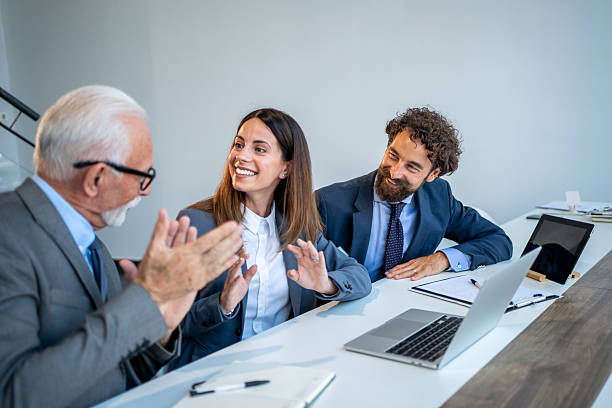 istock Business people clapping and smiling during a meeting 2225862671