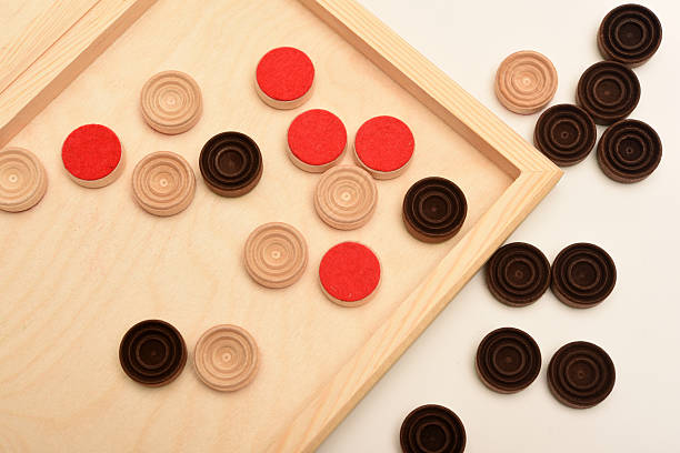 istock Wooden checkers on the board. The board game checkers. 2225863190
