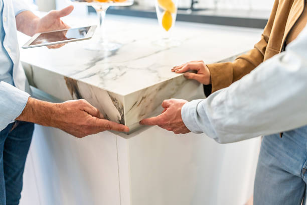 istock Interior designer showing kitchen countertop installation to customers 2225863933