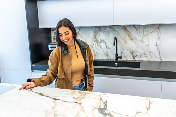 istock Customer choosing marble countertop in modern kitchen showroom 2225864086