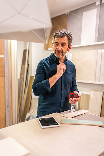 istock Architect choosing materials for bathroom renovation project in home improvement store 2225864177