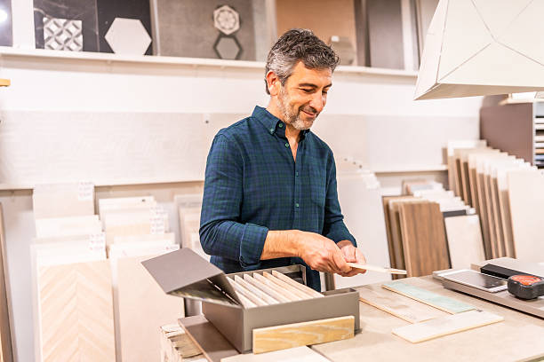 istock Mature man choosing tiles in a home improvement store 2225864257